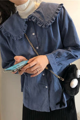 Blusa lisa con cuello Peter Pan